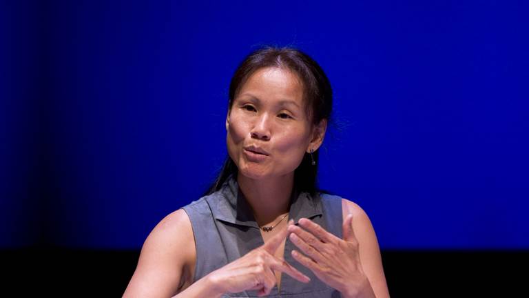 Ping Chong signing on stage