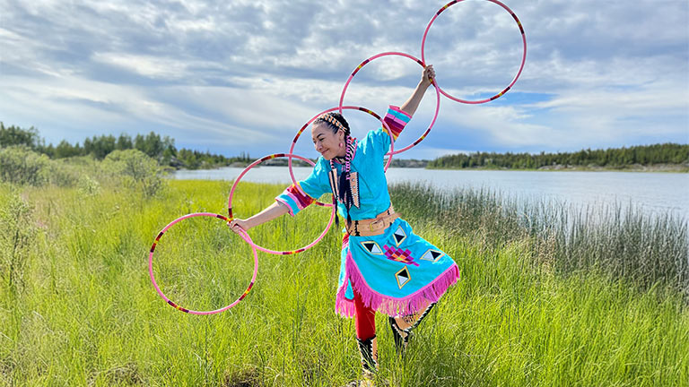 Angela Gladue dancing with hoops