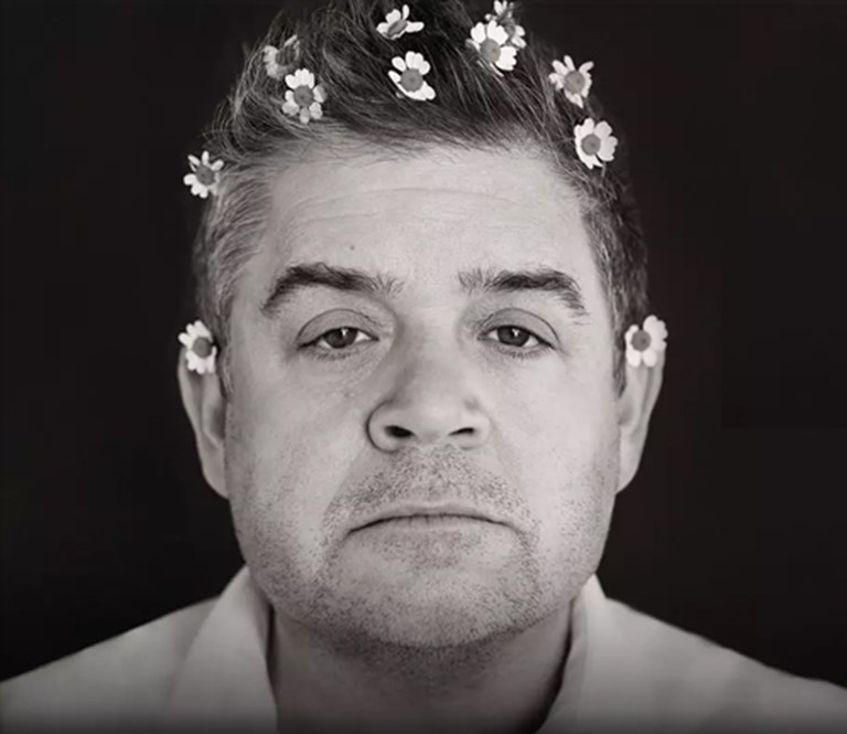 Patton Oswalt with flowers in his hair