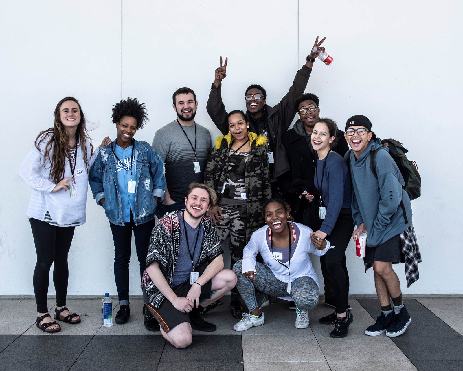 Ten college students pose for a happy group photo. 