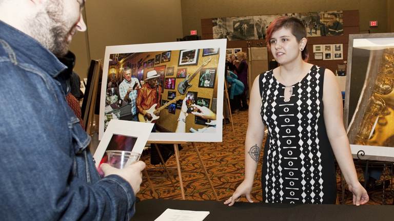 A young woman showcases her photography