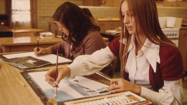 Two students painting 
