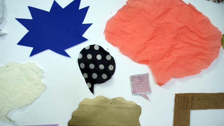 Different types of paper cut out in speech-bubble shapes
