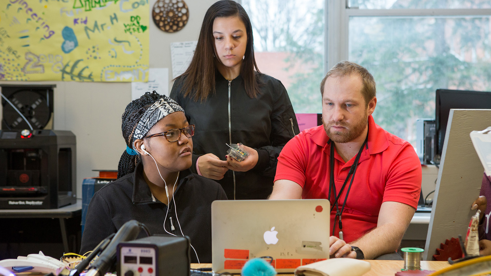 a teacher using technology with students.jpg