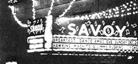 A black-and-white photo of the exterior of Savoy Ballroom, including its marquee sign.
