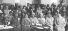 A black-and-white photo of a large group of well-educated Black people posed for the camera.