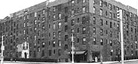 A black-and-white exterior photo of the Dunbar Apartments building.
