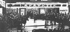 A black-and-white exterior image of the Lafayette Theater, featuring its marquee sign and a crowd of people.