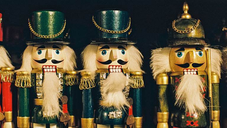 Three wooden nutcracker soldiers. 
