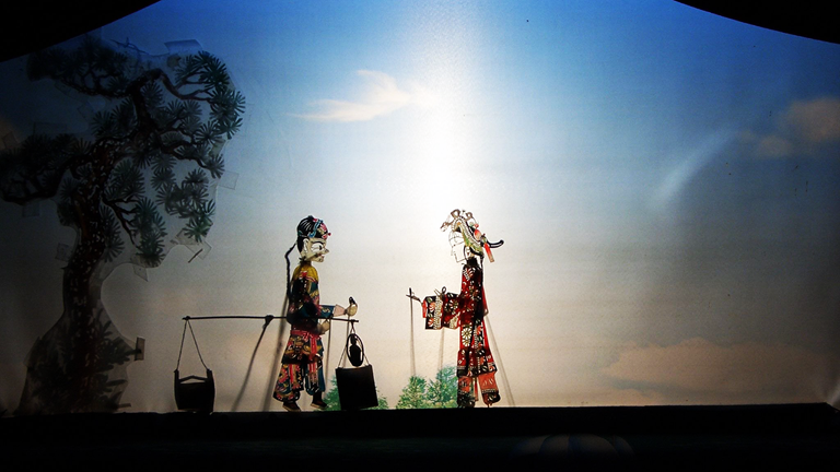 A traditional Chinese shadow puppet theater production. 