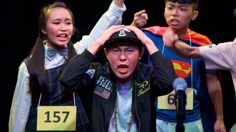 A group of four teens playing different characters in a play.