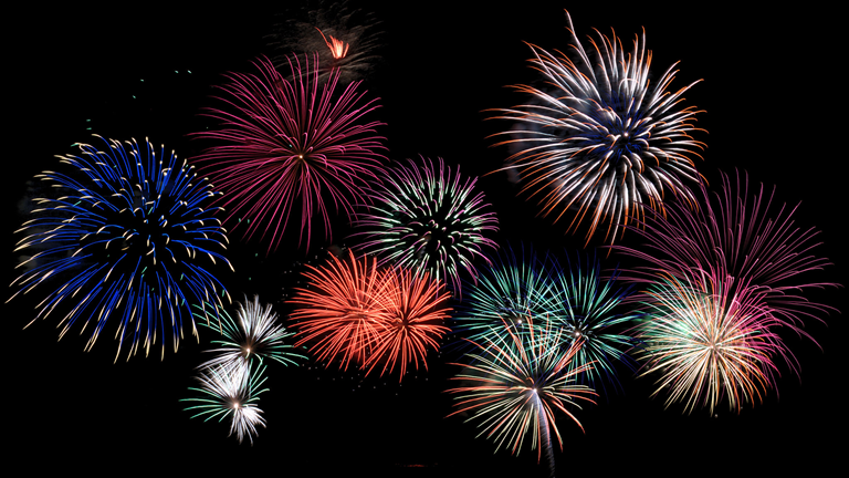 A colorful firework display in a dark sky.
