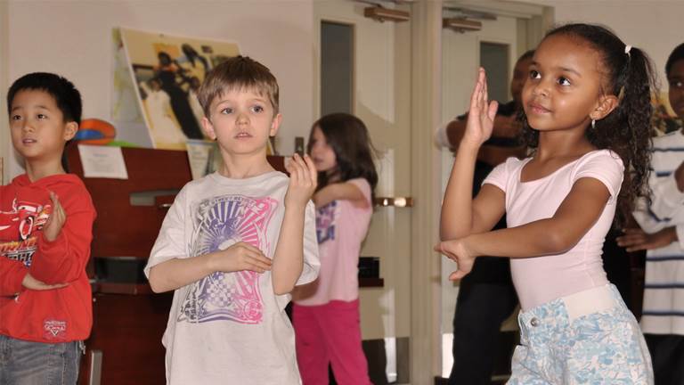 Children dancing in unison. 