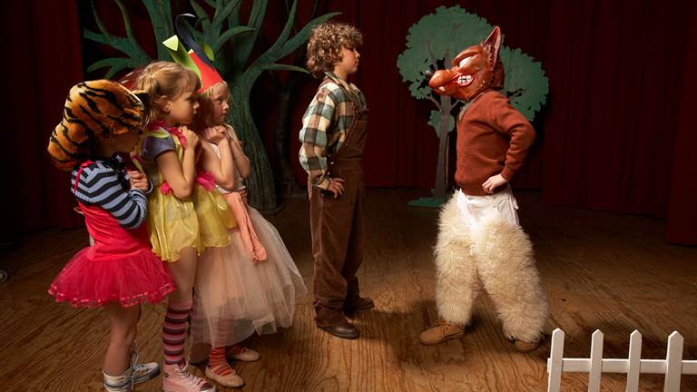A child actor confronting the big bad wolf during a performance.