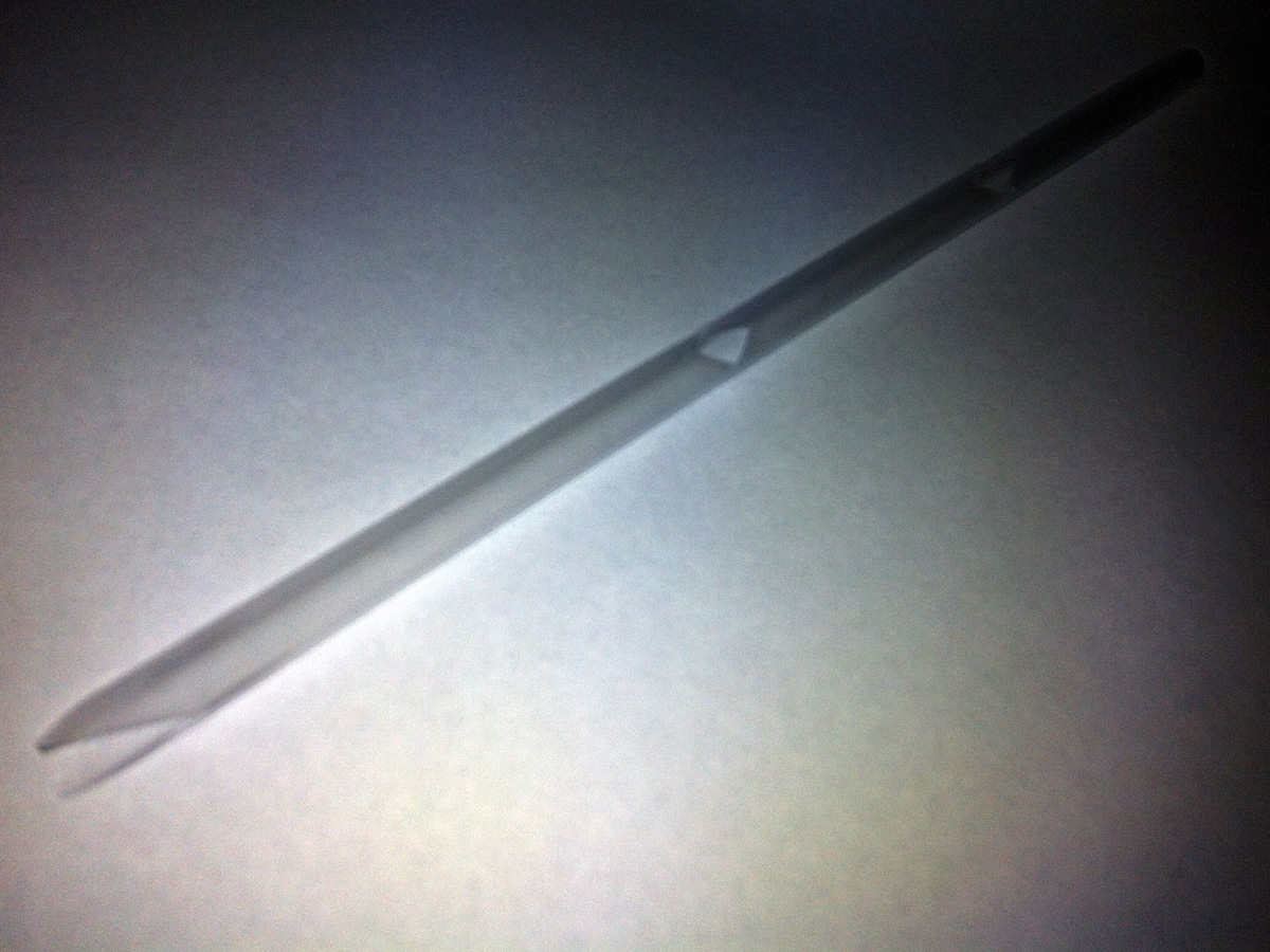 A photo of a straw with triangular holes cut out to make a do-it-yourself straw oboe.