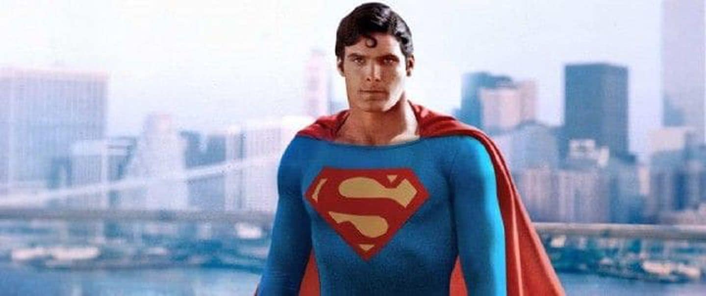 A photo of actor Christopher Reeves as Superman, wearing his signature blue, red, and yellow superhero outfit.