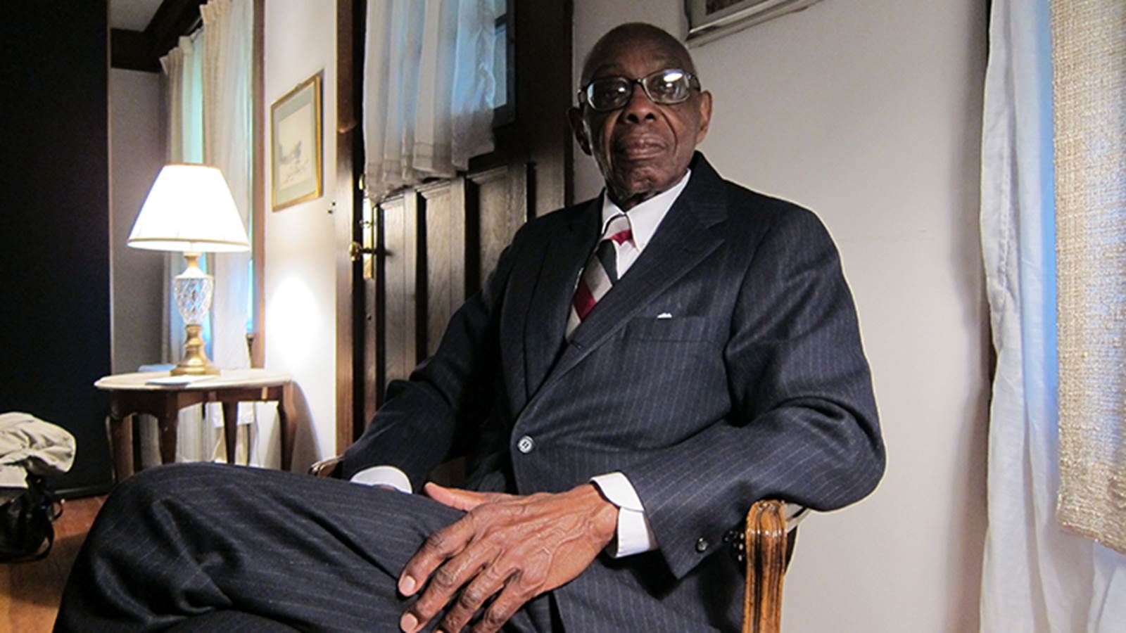George Walker sitting in a chair
