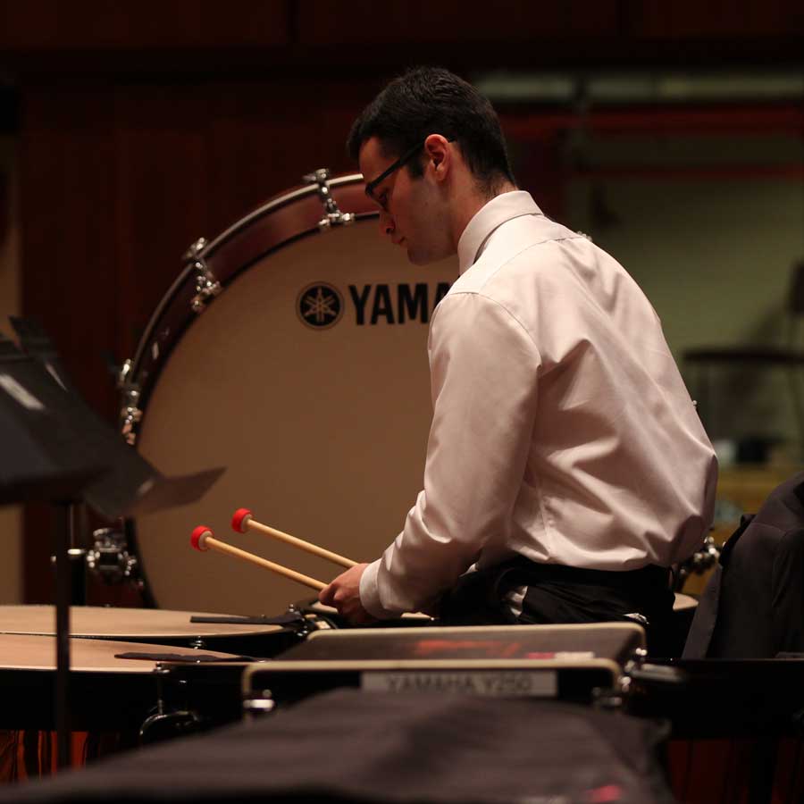 A musician playing the drums.