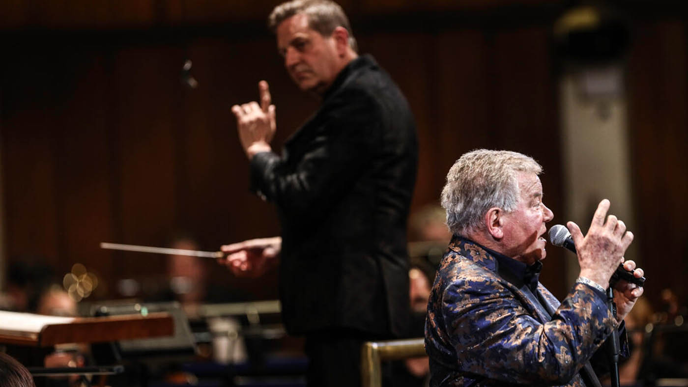 William Shatner singing with NSO while Steven Reineke  is conducting.