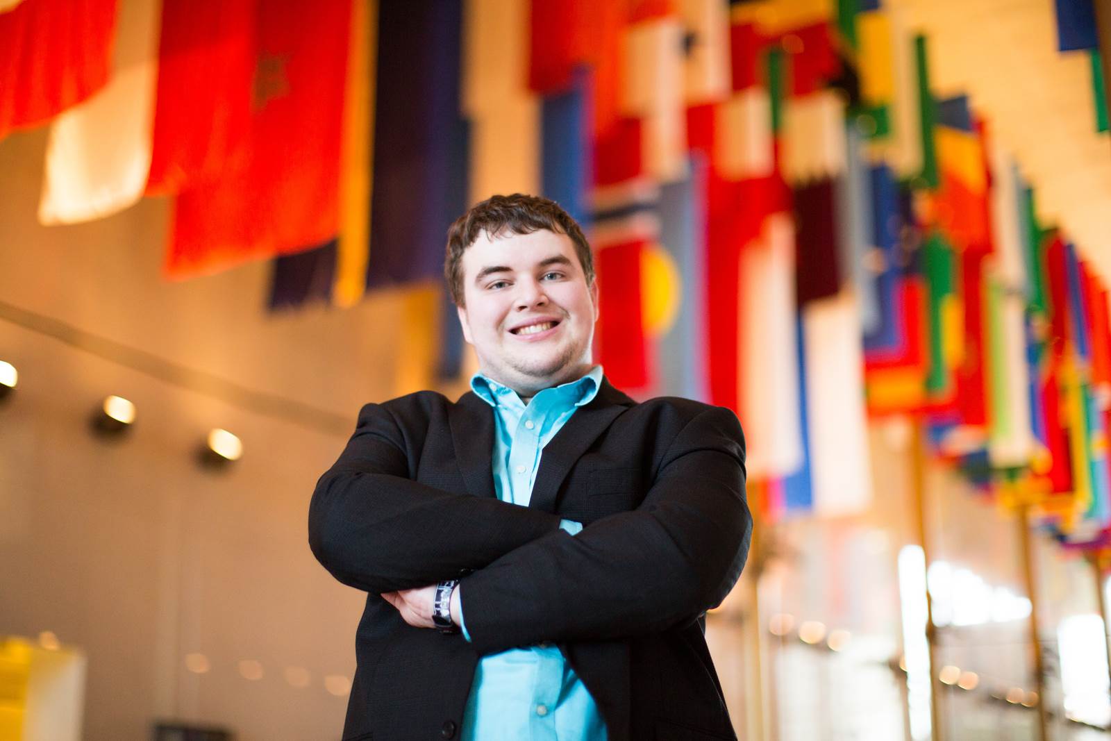 An EEI intern stands in the Hall of Nations