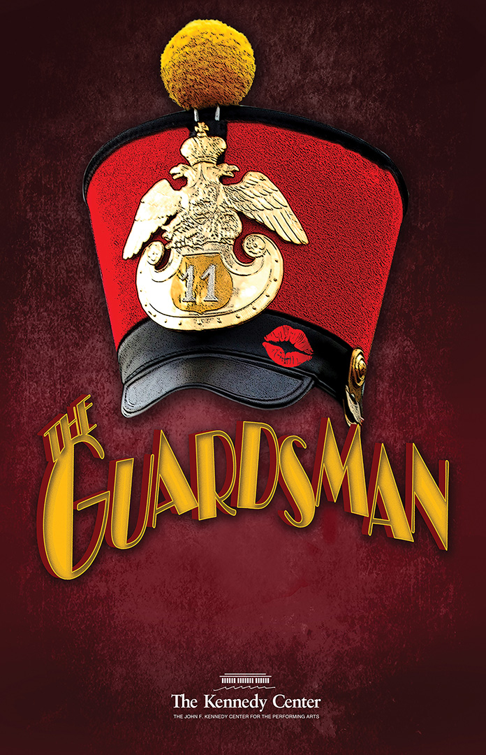 A tall red velvet soldier's hat is adorned with a gold eagle crest and pom-pom. The black brim of the hat has a red lipstick print of a kiss.