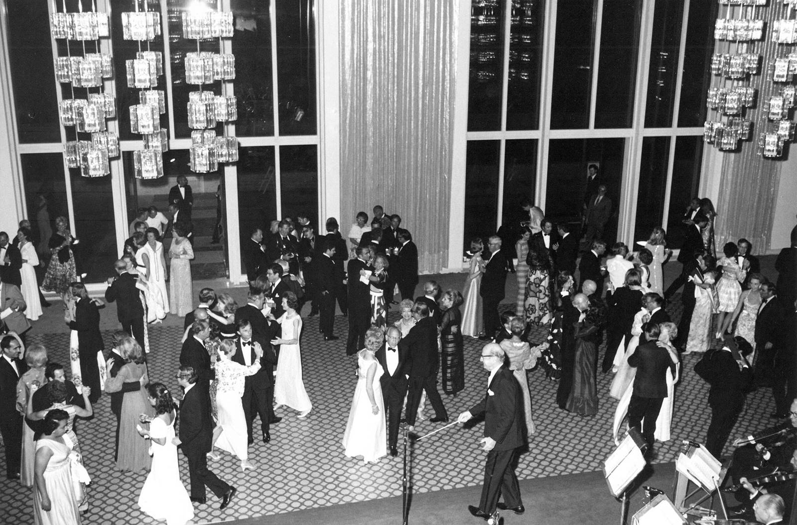 Patrons mingle and dance in the foyer at the 1971 Preview Gala