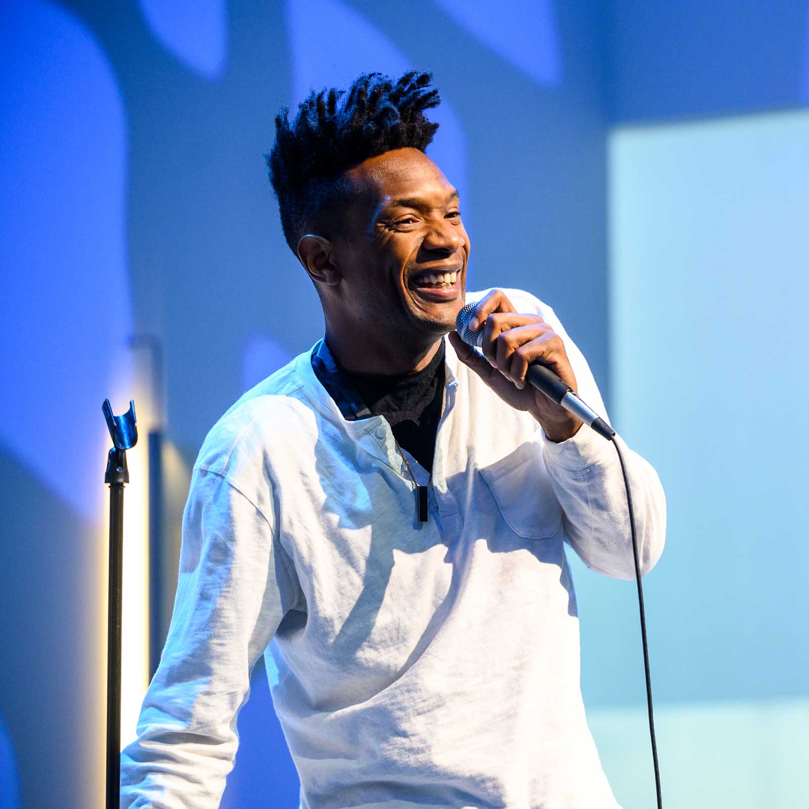 A stand up comedian at the REACH festival.