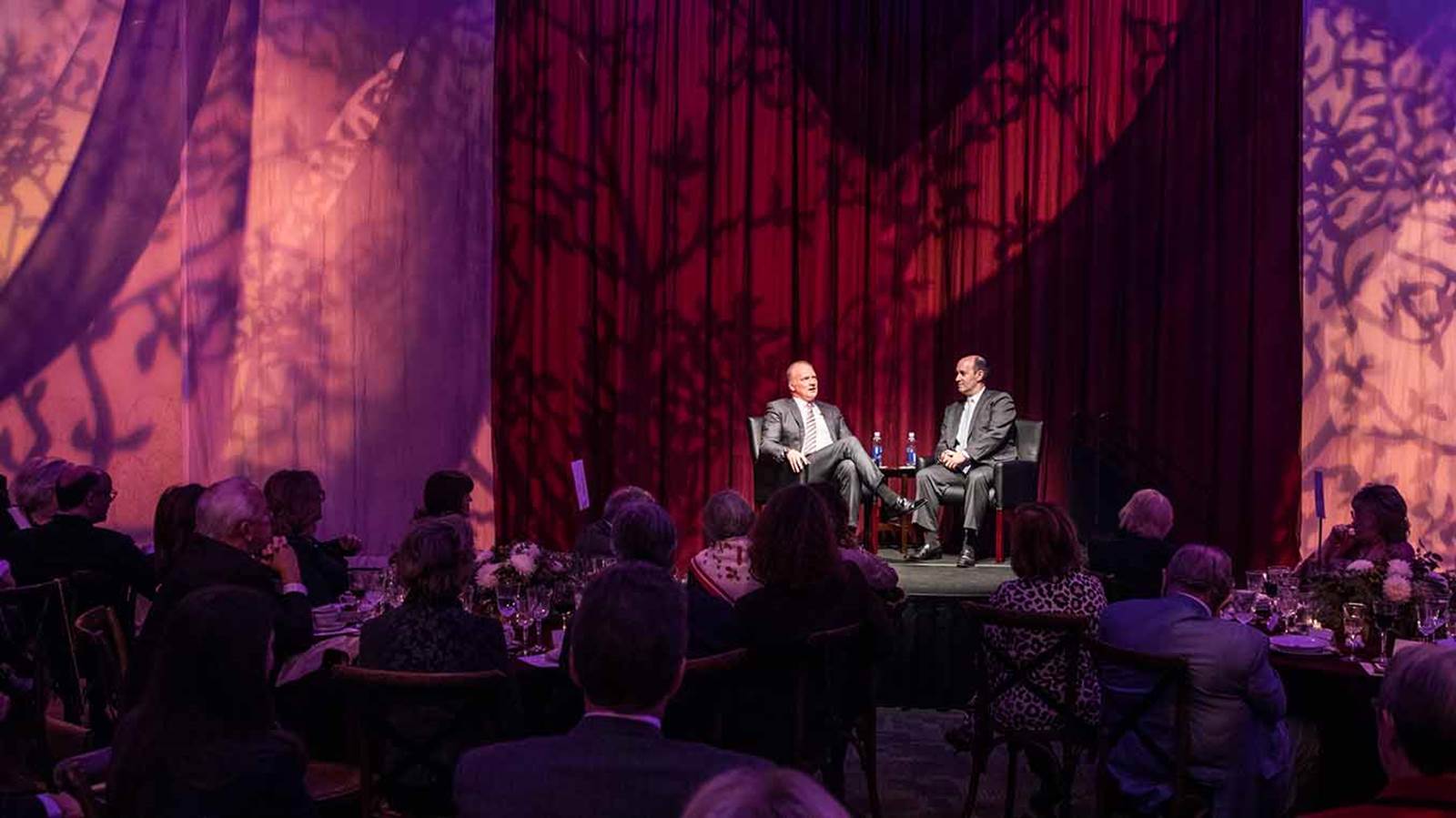 A photo of an NSO event, featuring an interview and a dinner.. 