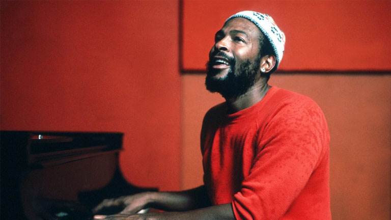 Marvin Gaye palying the piano and singing