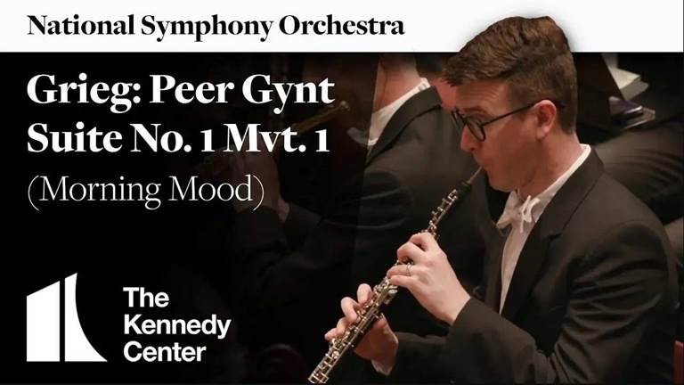 Oboeist performs while looking at sheet music