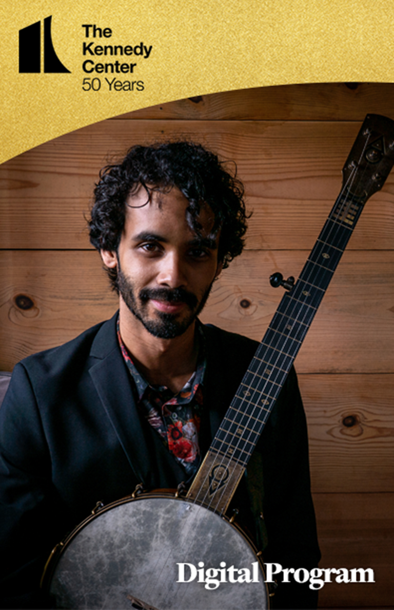 KC 50 Program for Jake Blount holding his wood and brass banjo