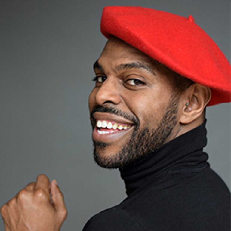 Breon Arzell in a red beret