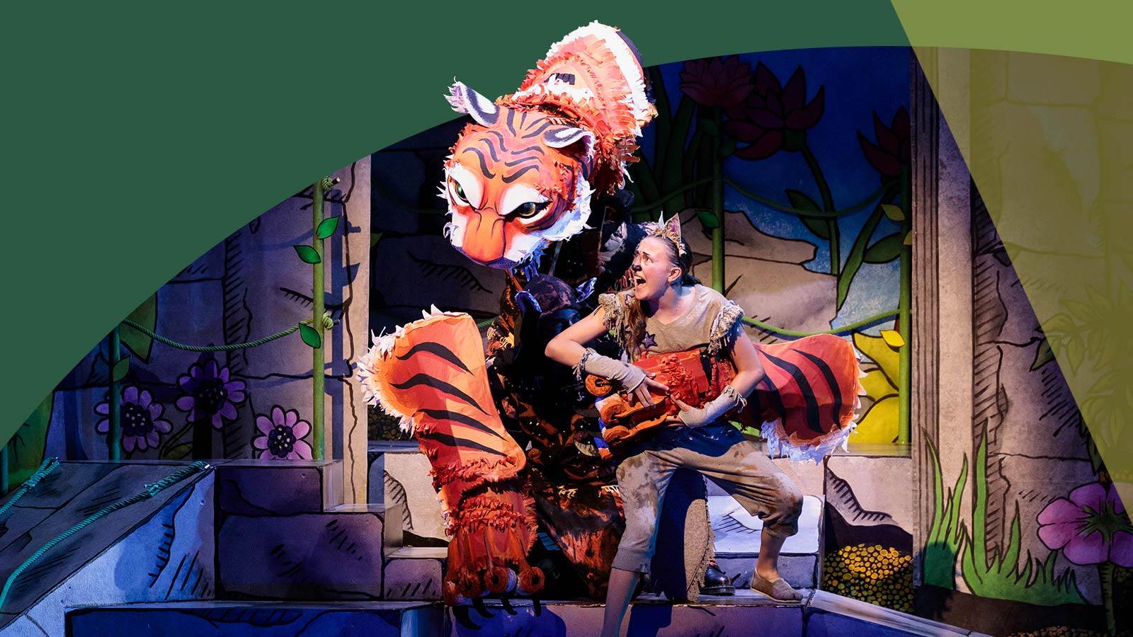 Shere Khan and Mowgli in opera Jungle Book with Mowgli looking scared